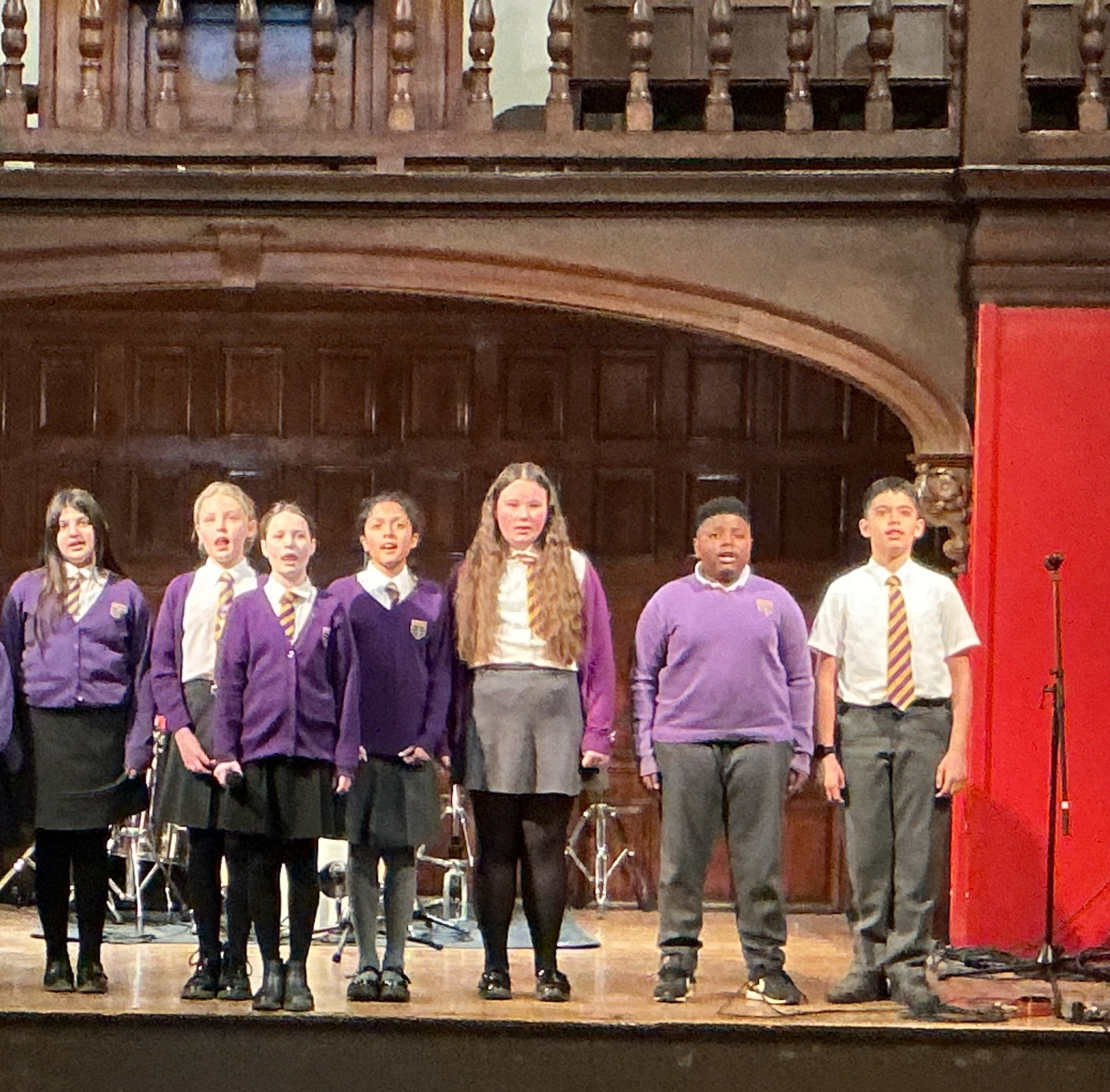 Children singing at Bradby Hall, Haileybury